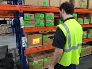 WDS Savannah uses state of the art warehouse management software. Here, an employee is scanning products stored on our new racking.
