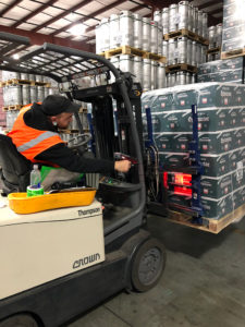 WDS Savannah uses state of the art warehouse management sottware. Here, an employee on Tow Motor is scanning a pallet label.